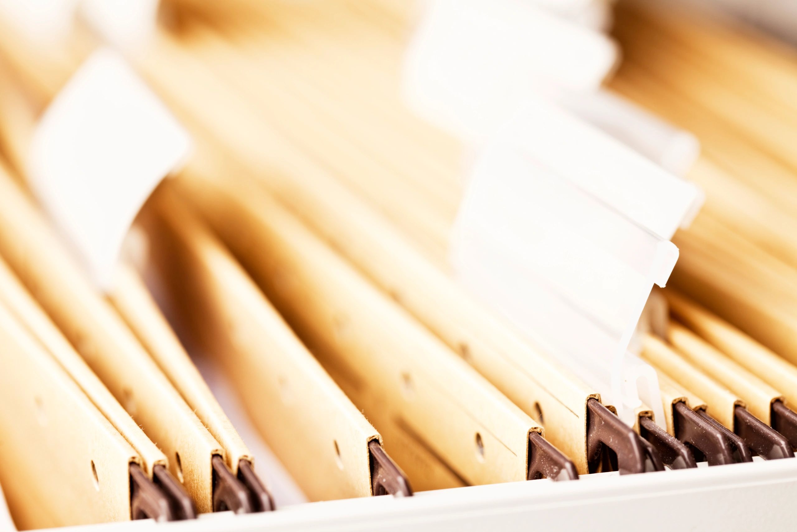 Close-up of a file cabinet with paperwork