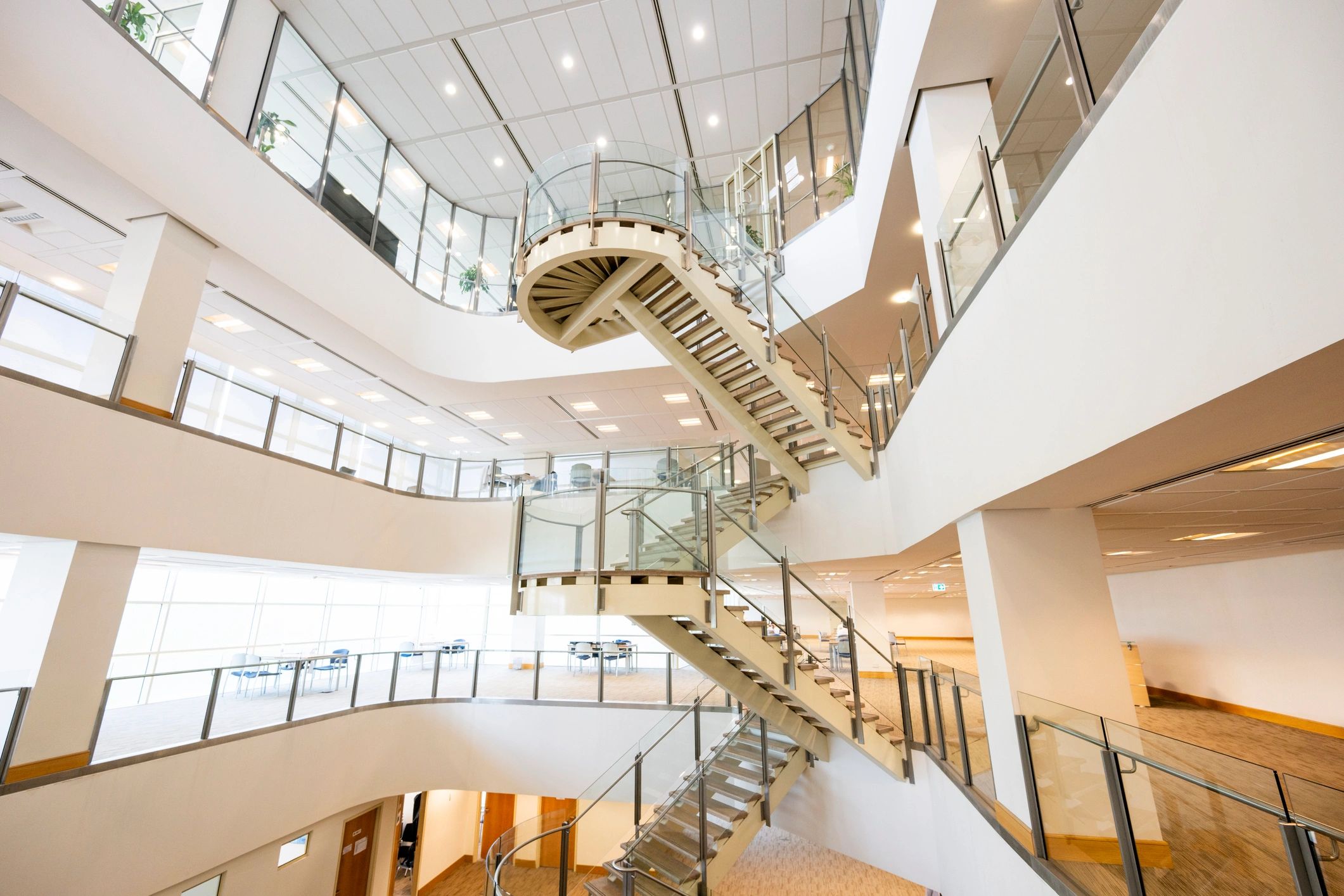 Modern library interior with stairs and natural light