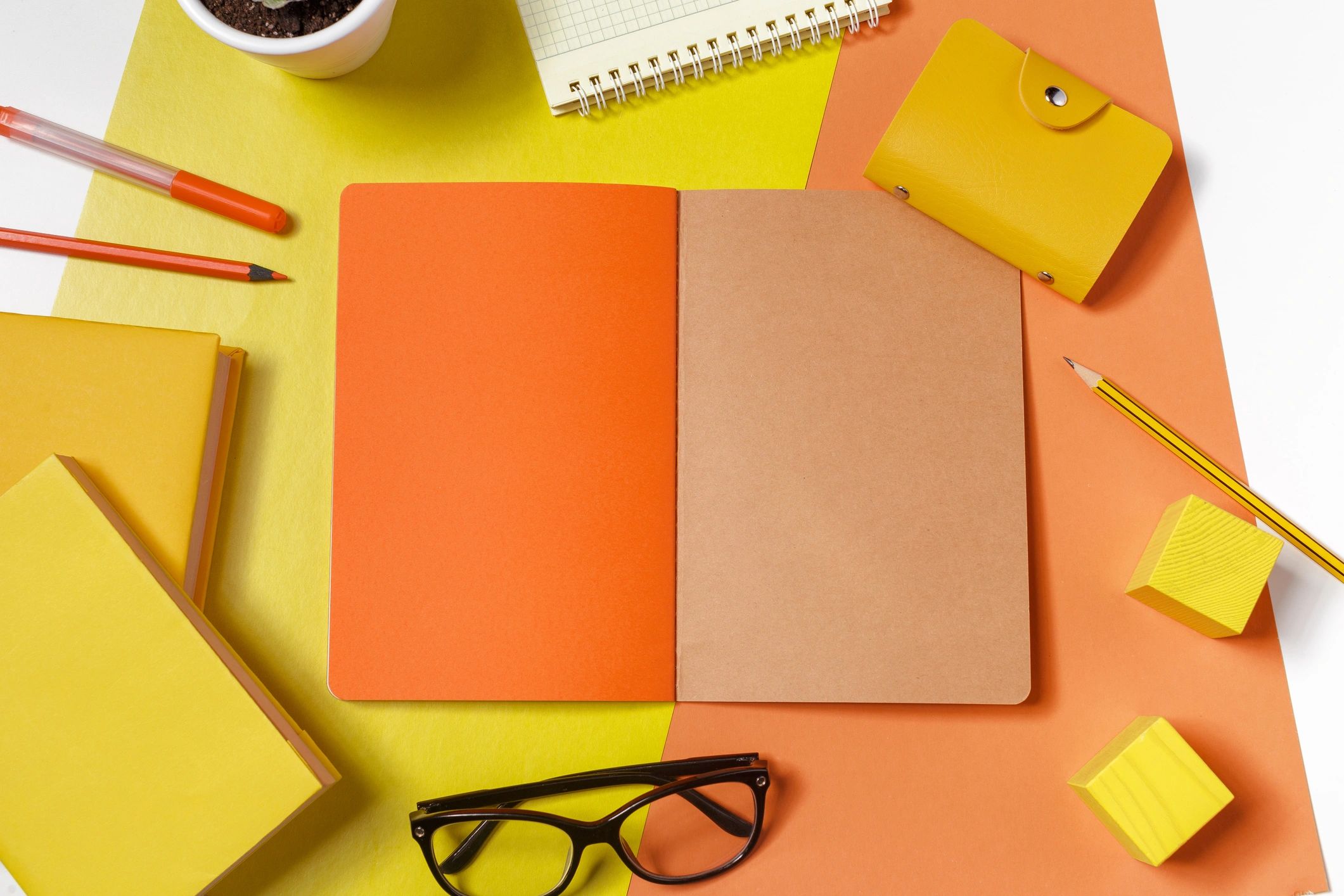 Notebooks and stationery on a minimalist writing desk